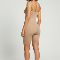 Beige tummy control fajas shapewear, back view on model.