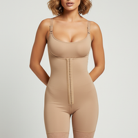 Beige tummy control fajas shapewear, front view on model.