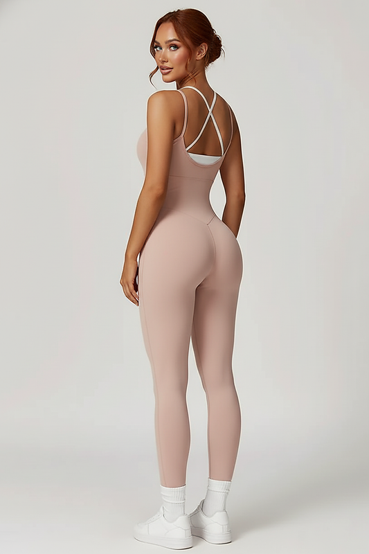 Color-blocked jumpsuit gym set, back view on model.