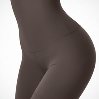 Black high-waist shaper, close-up fabric detail.