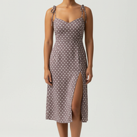 Polka dot sundress, side view on model.