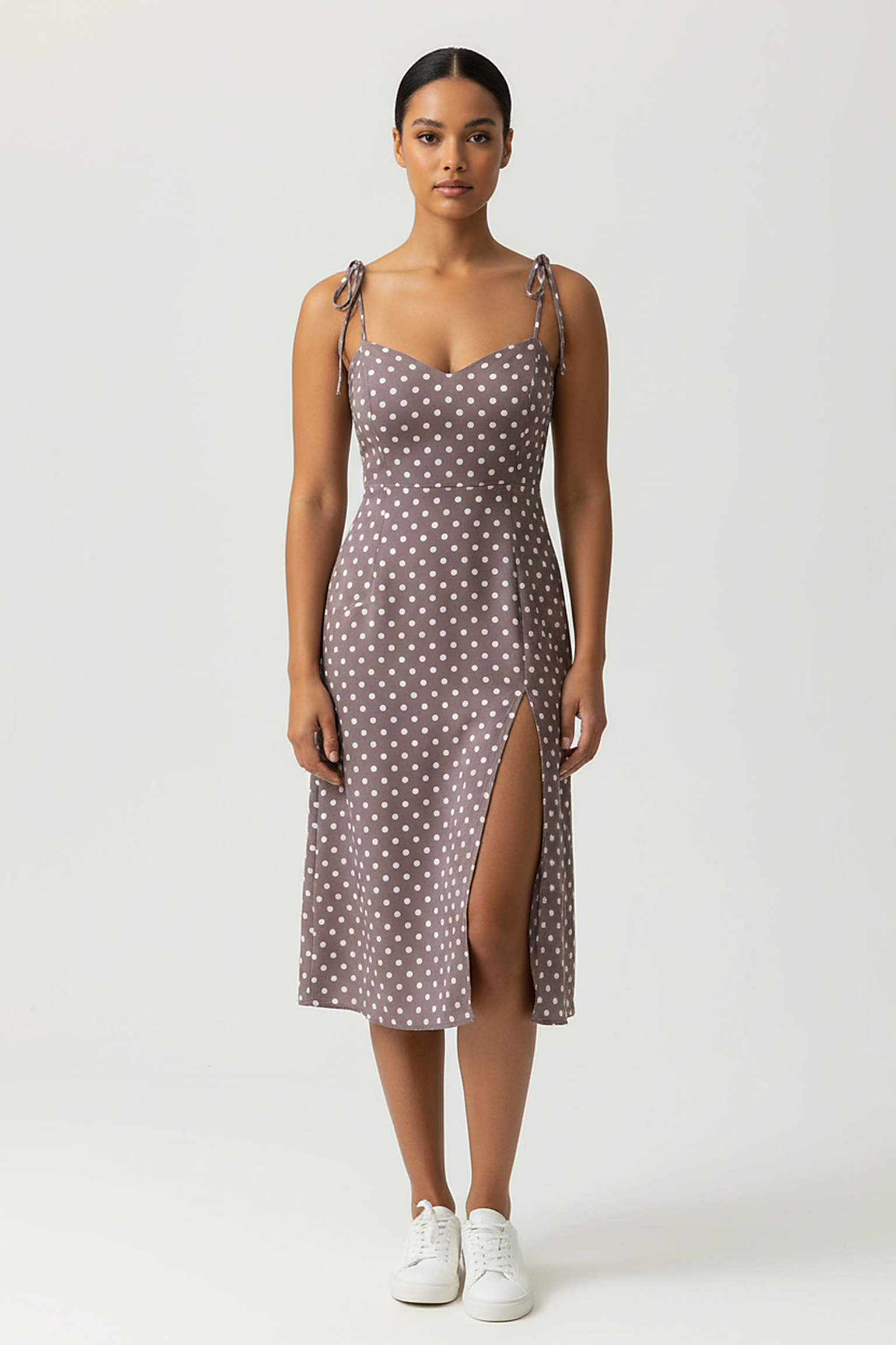 Polka dot sundress, side view on model.