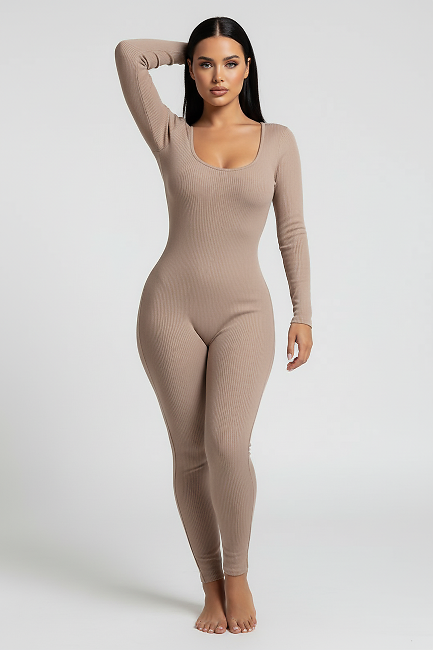 Black long-sleeve bodycon jumpsuit, waist and seam detail.