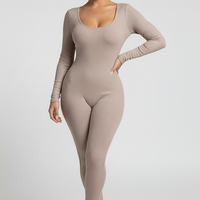 Black long-sleeve bodycon jumpsuit, back view, standing model.