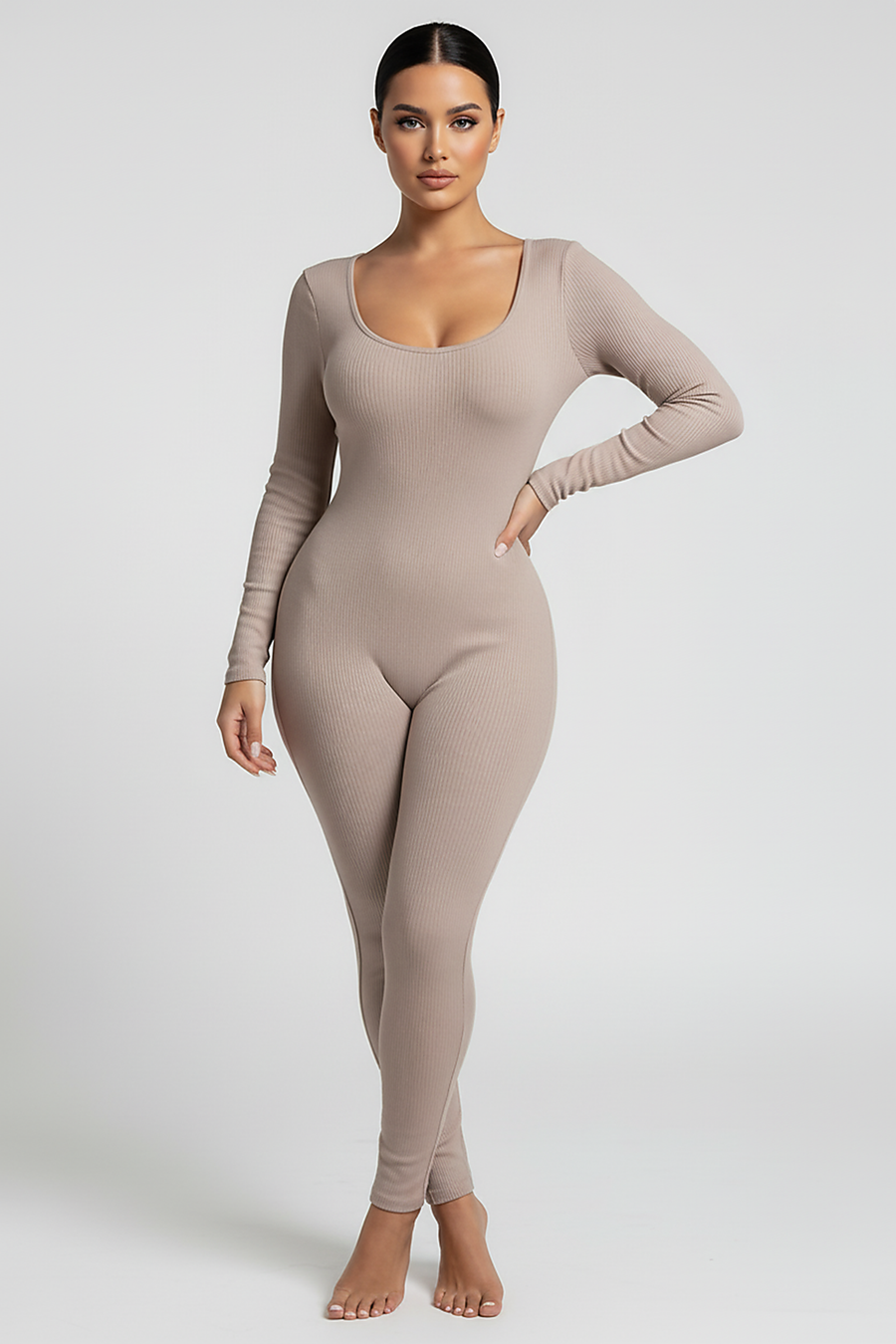 Black long-sleeve bodycon jumpsuit, waist and seam detail.