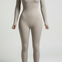 Black long-sleeve bodycon jumpsuit, neckline and collar detail.