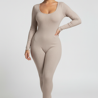 Black long-sleeve bodycon jumpsuit, front view, standing model.