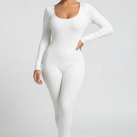 Black long-sleeve bodycon jumpsuit, front view on model.