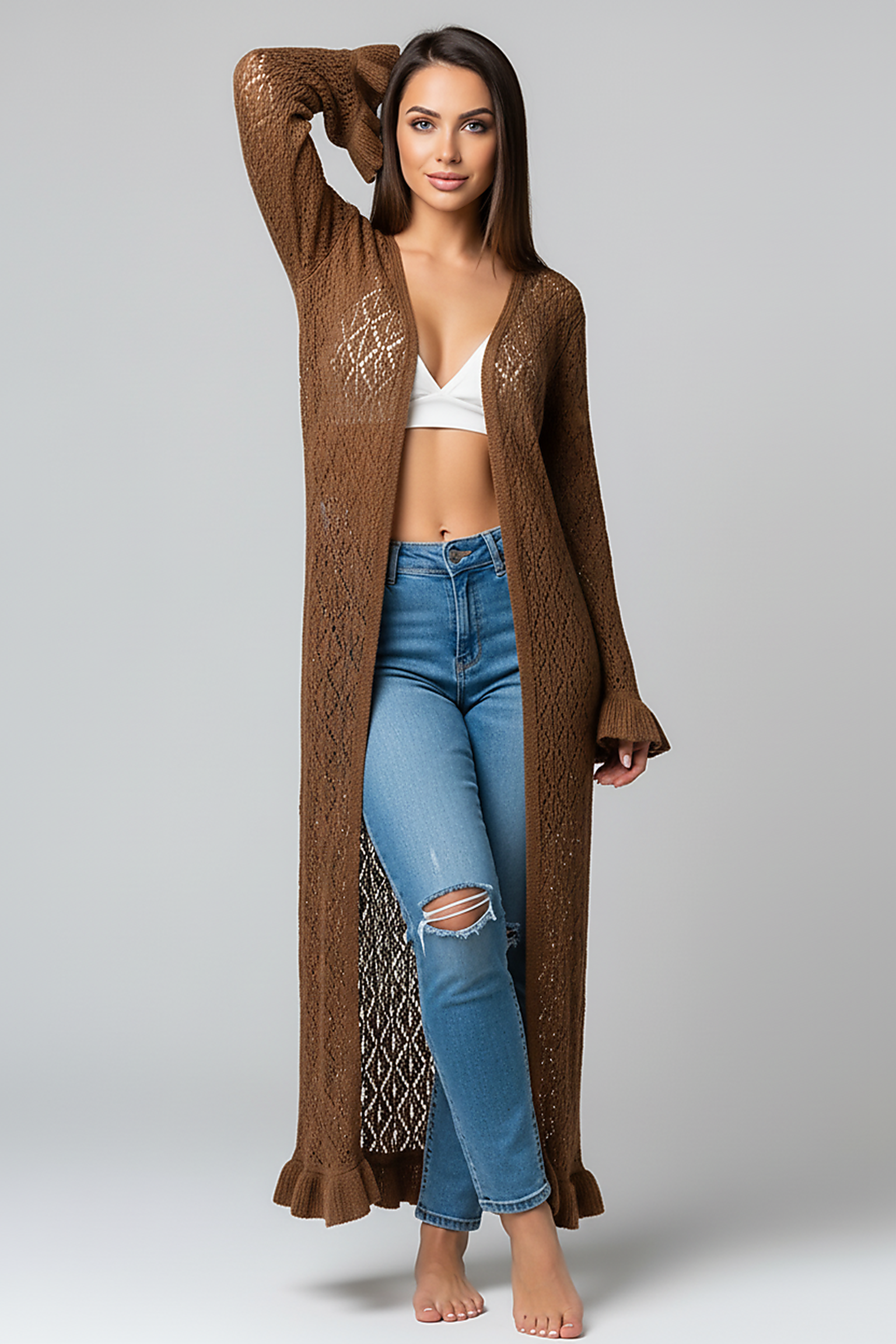 woman wearing black ribbed knit wrap top and matching A-line skirt, front view, standing, hands relaxed