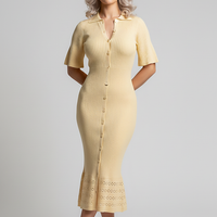 White single-breasted knit maxi dress. Front view on model.