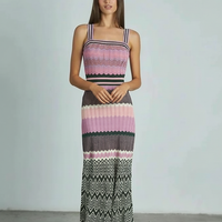 Black sleeveless knitted dress, back detail close-up.