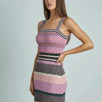 Black sleeveless knitted dress, back view on model.