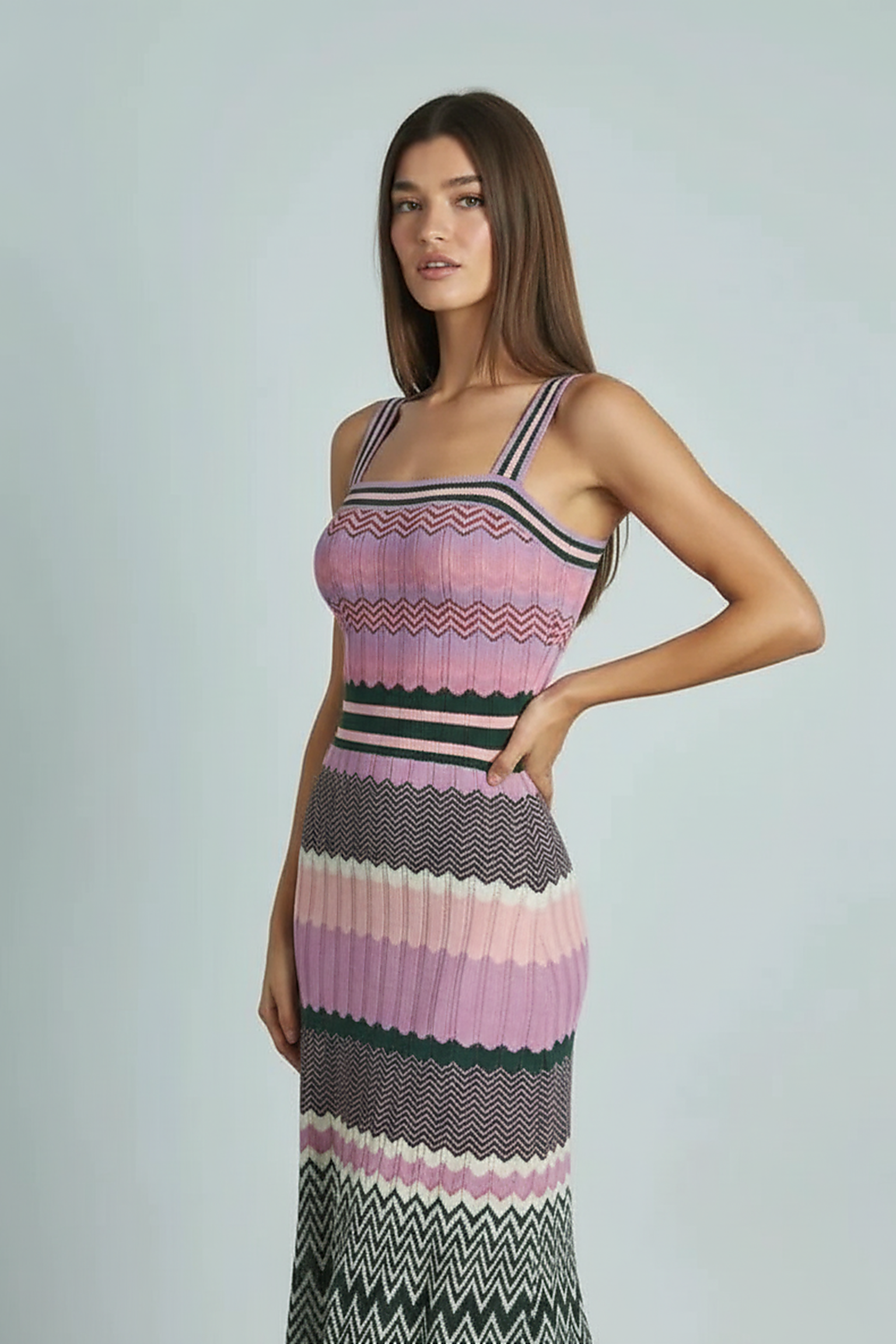 Black sleeveless knitted dress, back view on model.