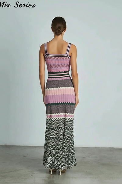 Black sleeveless knitted dress, side view on model.