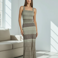 Black sleeveless knitted dress, square collar detail.