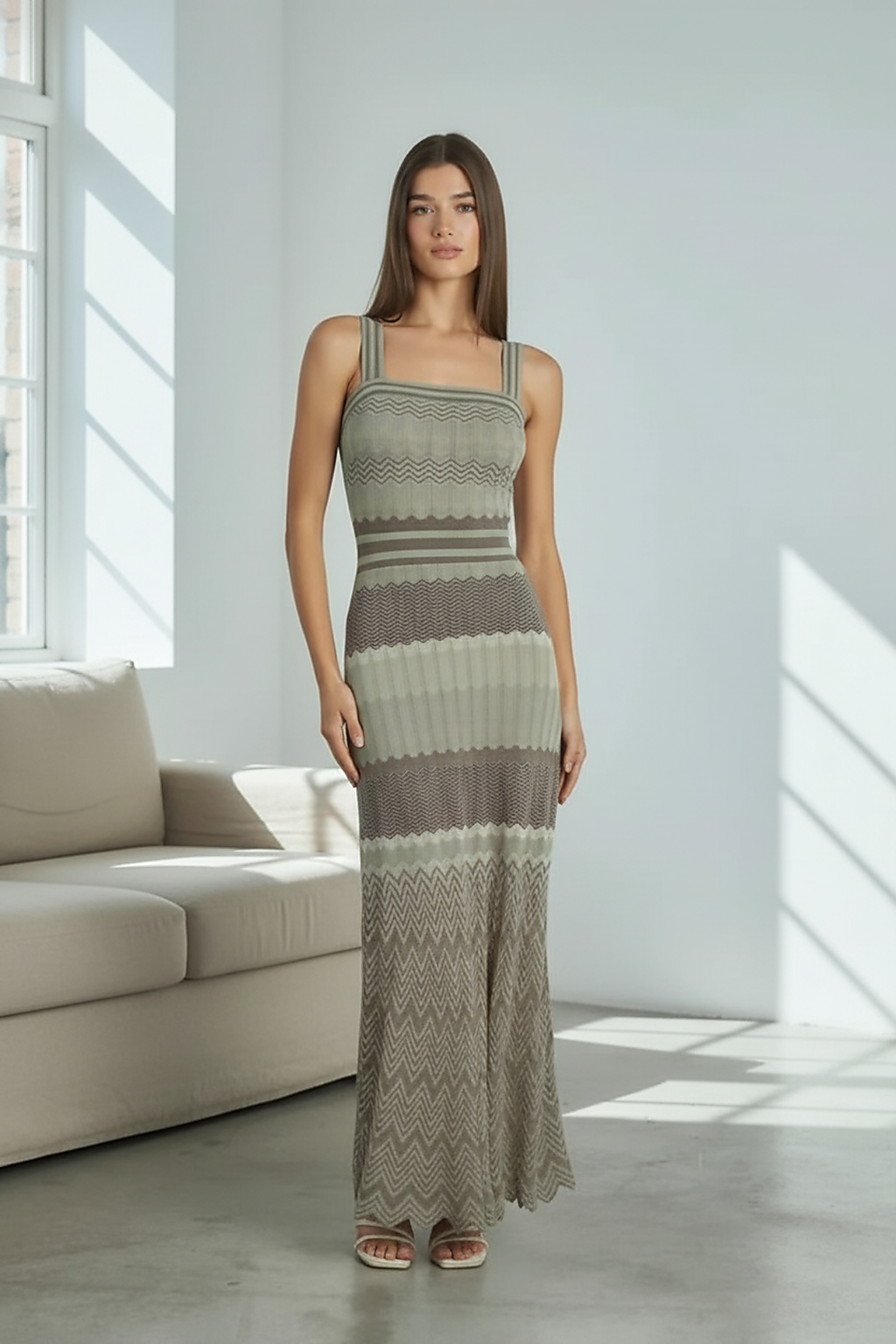 Black sleeveless knitted dress, square collar detail.