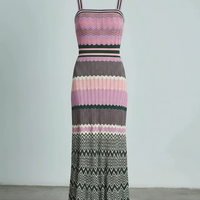 Black sleeveless knitted dress, hem detail.