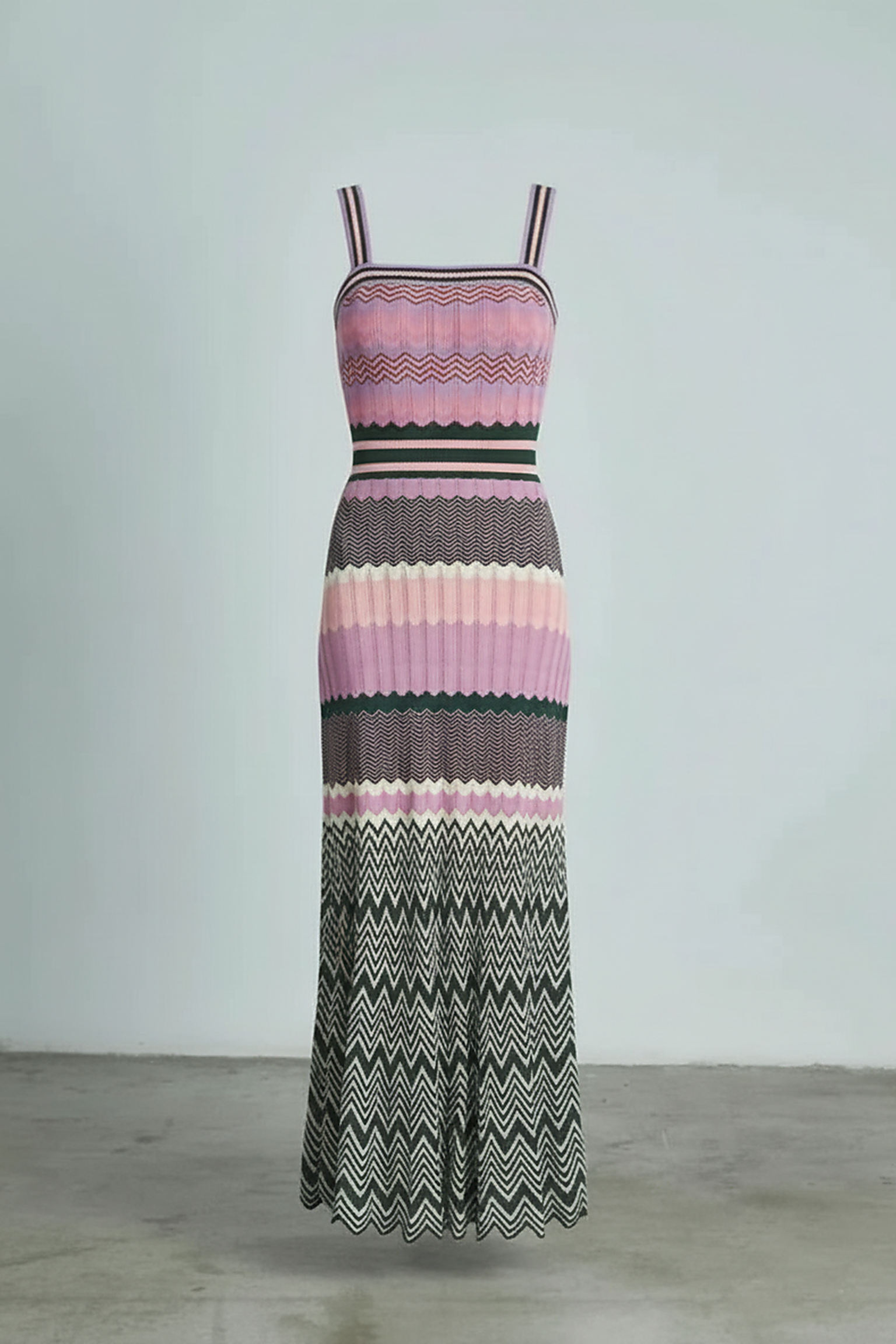 Black sleeveless knitted dress, hem detail.