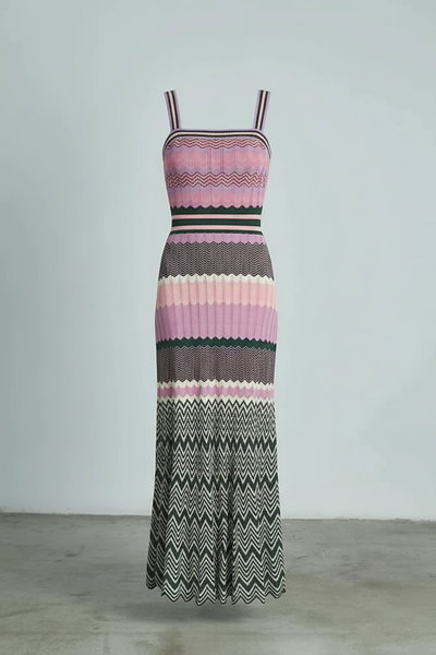 Black sleeveless knitted dress, hem detail.