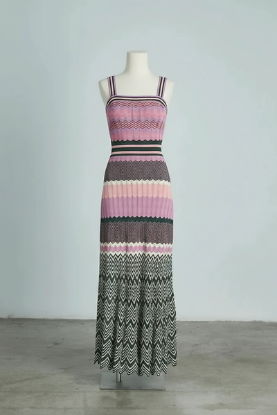 Black sleeveless knitted dress, close-up on model.