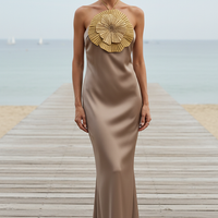 Halter mermaid satin dress with 3D flowers, side view on model.