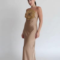 Detail of backless design on halter mermaid satin dress.