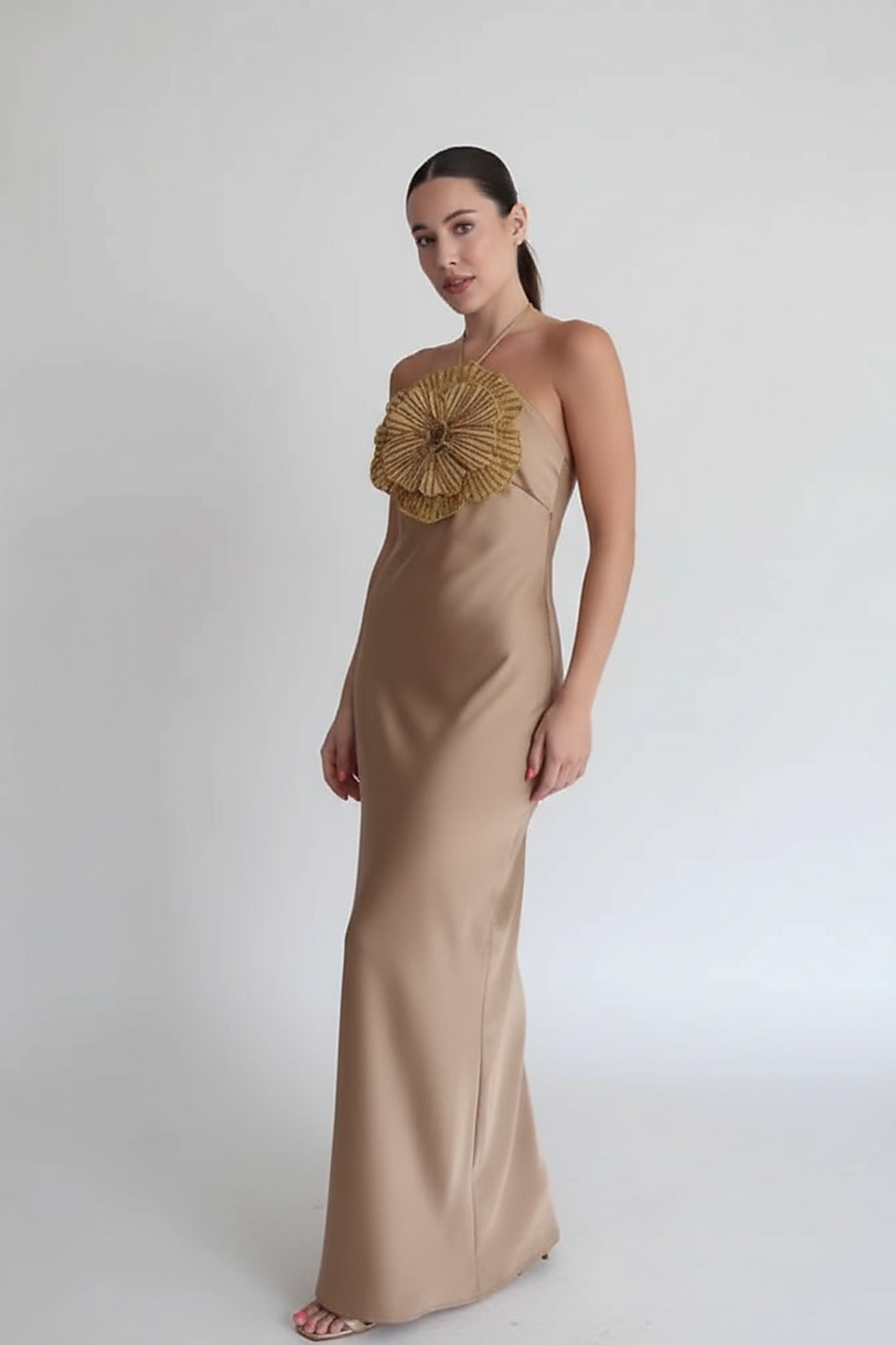 Detail of backless design on halter mermaid satin dress.