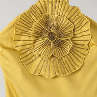 Fabric detail of satin halter mermaid dress.