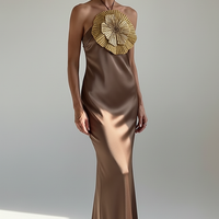 Detail of mermaid hem on halter satin dress.