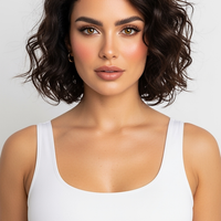 woman wearing black turtleneck sleeveless mini dress, front view, standing, hands relaxed