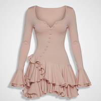 Front view of a model wearing a light pink long-sleeve mini dress with a ruffled hem and flare sleeves.; Front view of a model wearing a chocolate brown long-sleeve mini dress with an asymmetrical