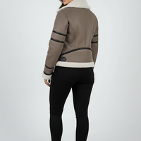 Cream synthetic sheepskin bomber jacket, model in a lifestyle pose.