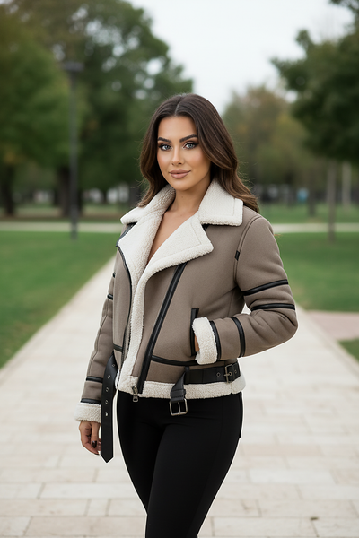 Cream synthetic sheepskin bomber jacket, open front on model.