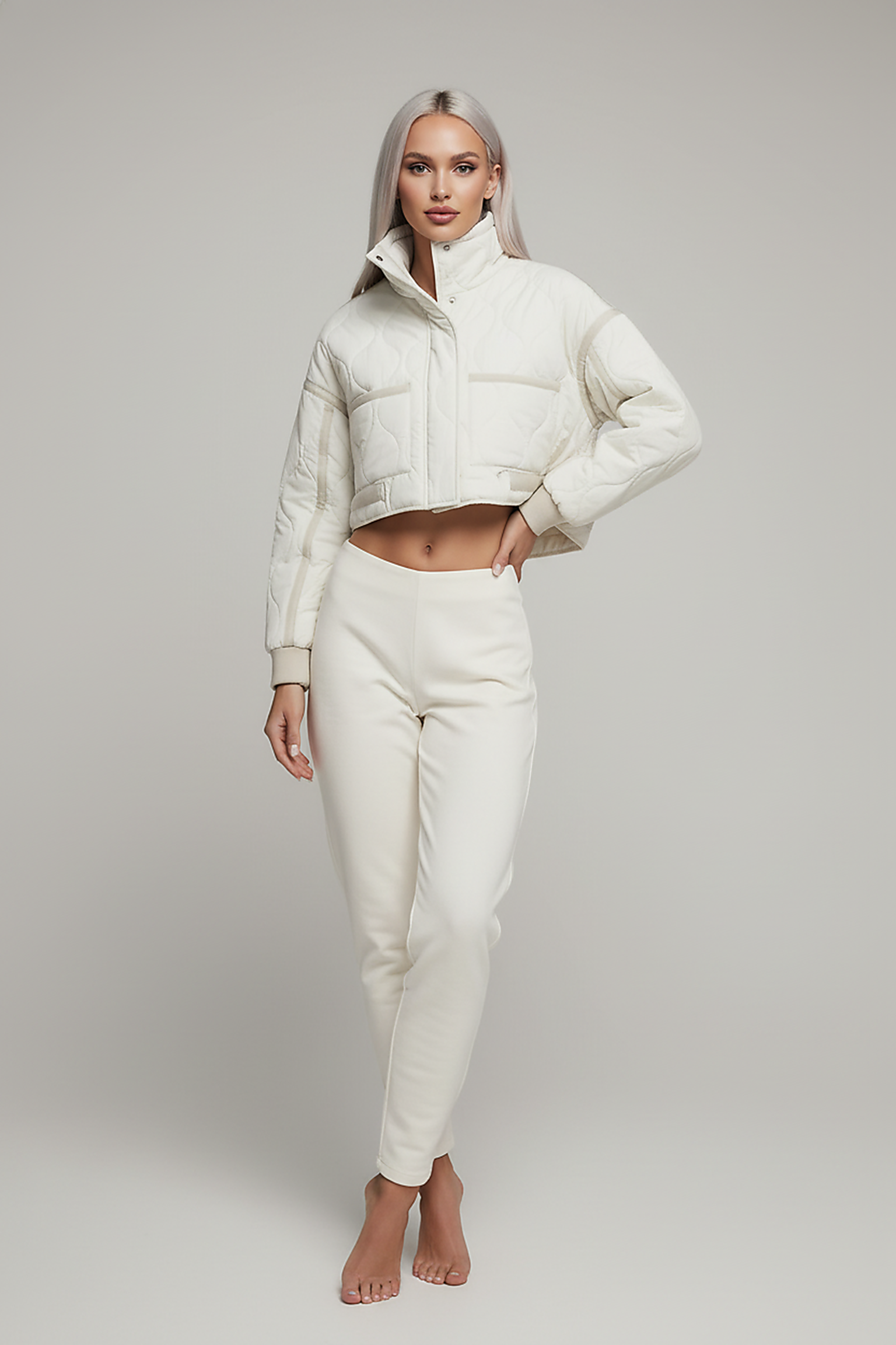 Stand-collar winter jacket, model in full length pose.