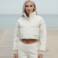 Stand-collar winter jacket, close-up of collar and fabric.