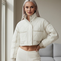 Stand-collar winter jacket, close-up of pocket and cuff.