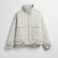 Stand-collar winter jacket, front view, model in motion.