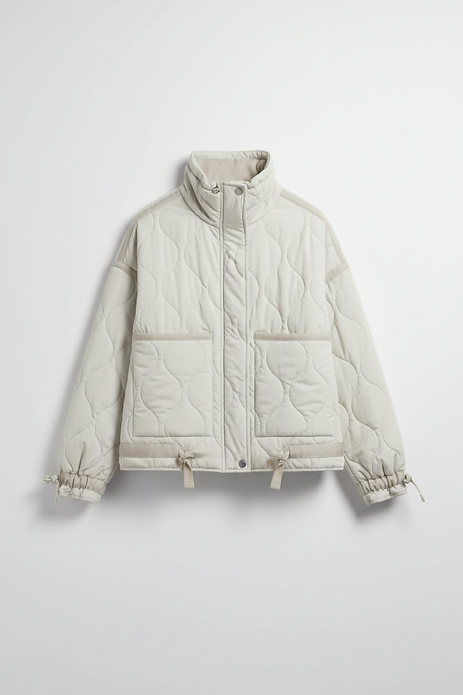 Stand-collar winter jacket, front view, model in motion.