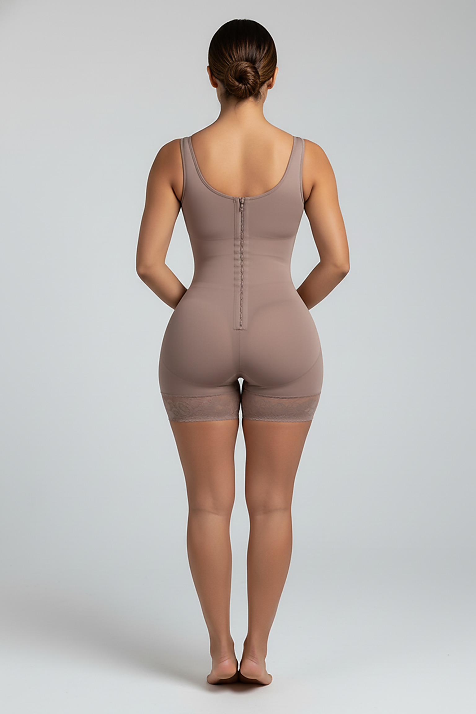 High-compression bodysuit, back view on model.