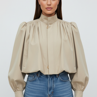 Womens beige trench coat, sleeve cuff detail.