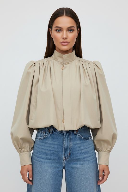 Womens beige trench coat, sleeve cuff detail.