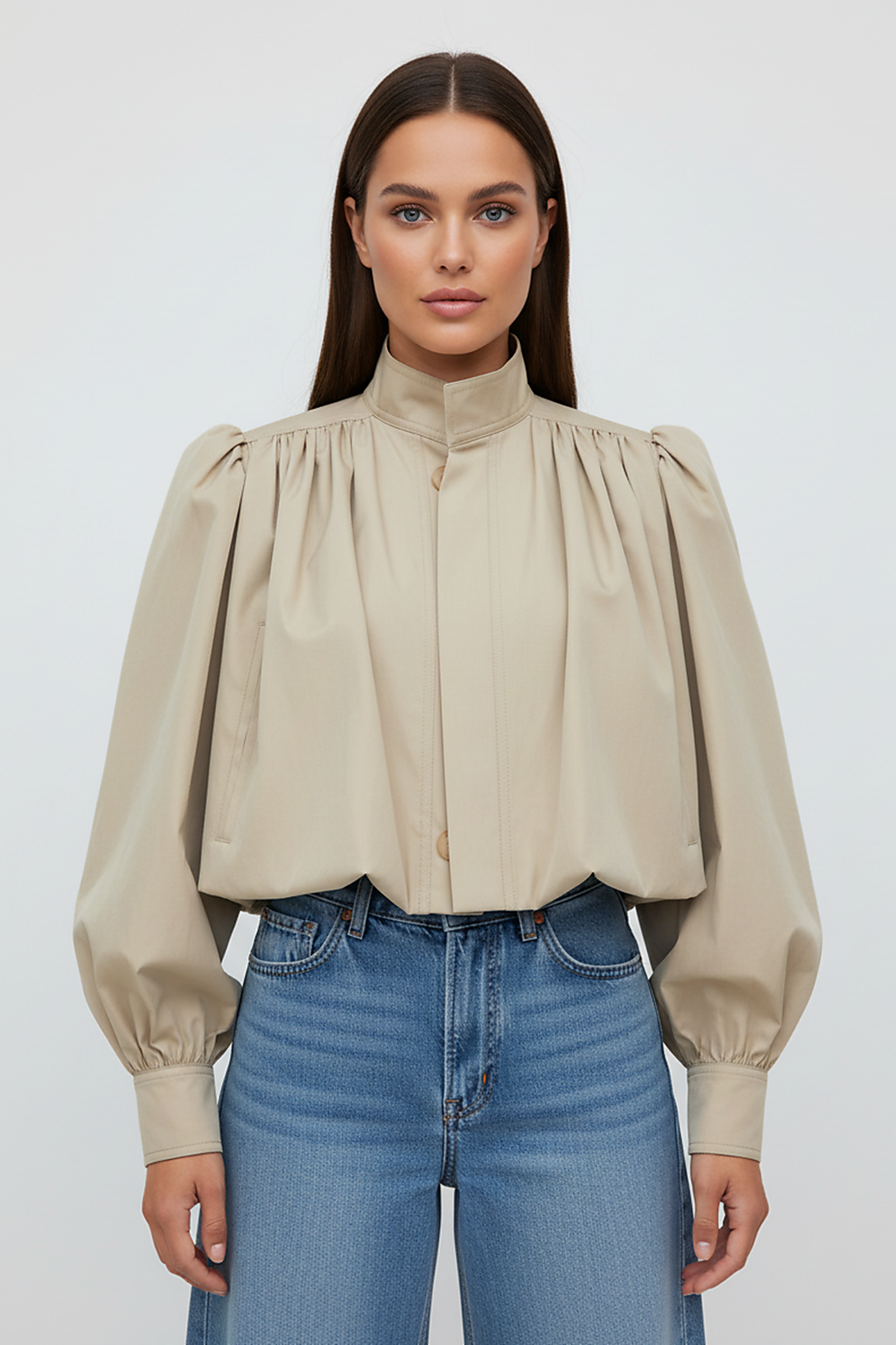 Womens beige trench coat, sleeve cuff detail.