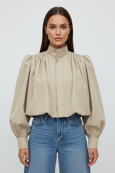 Womens beige trench coat, sleeve cuff detail.