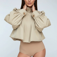 Womens beige trench coat, front view on model.