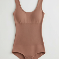 Solid one-piece garment, profile view on model.