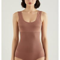 Solid one-piece garment, fabric detail close-up.