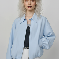 Beige short jacket, close-up detail.