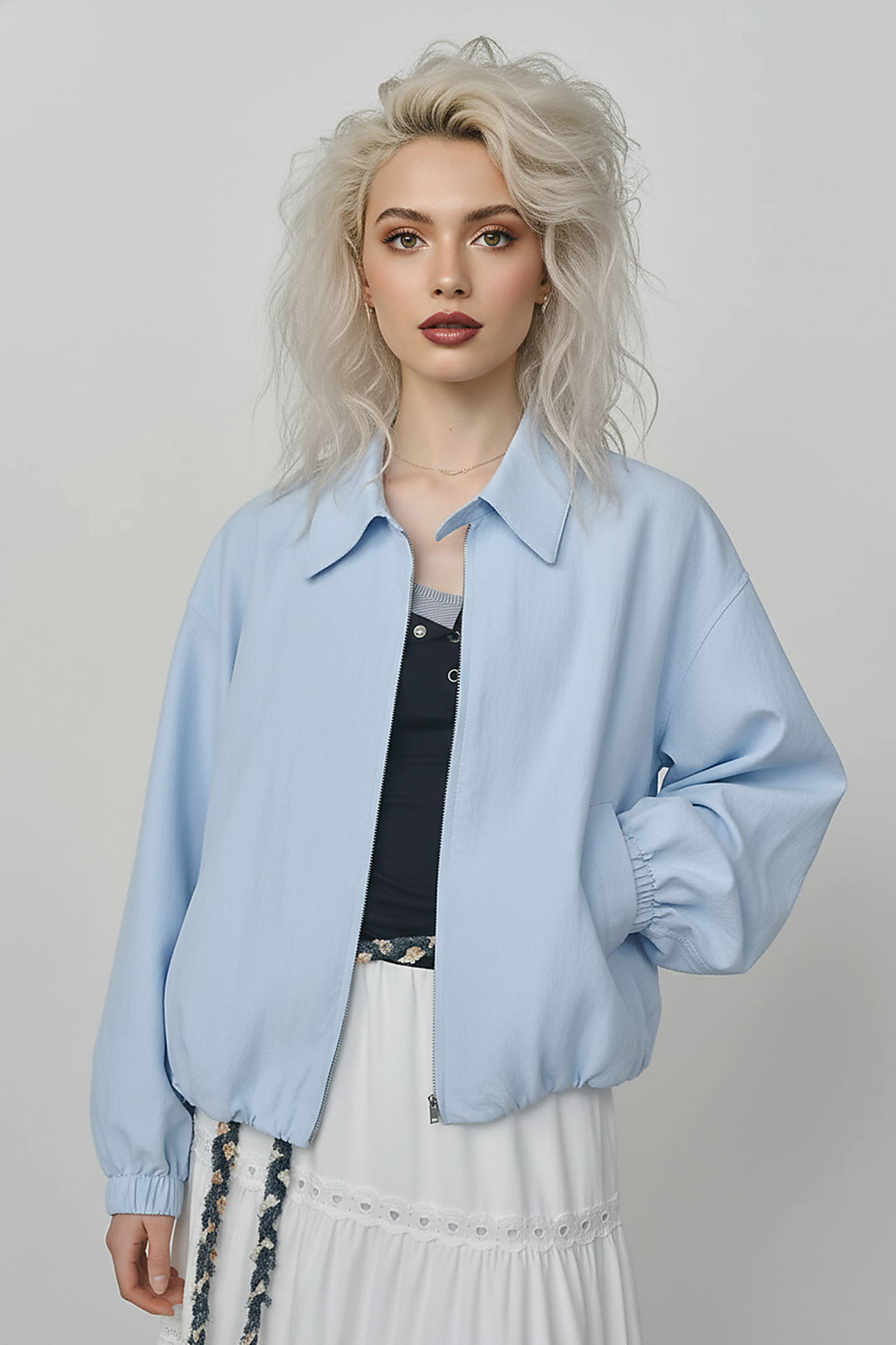 Beige short jacket, close-up detail.