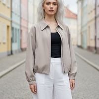 Beige short jacket, fabric texture detail.