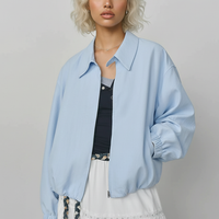 Beige short jacket, sleeve detail.